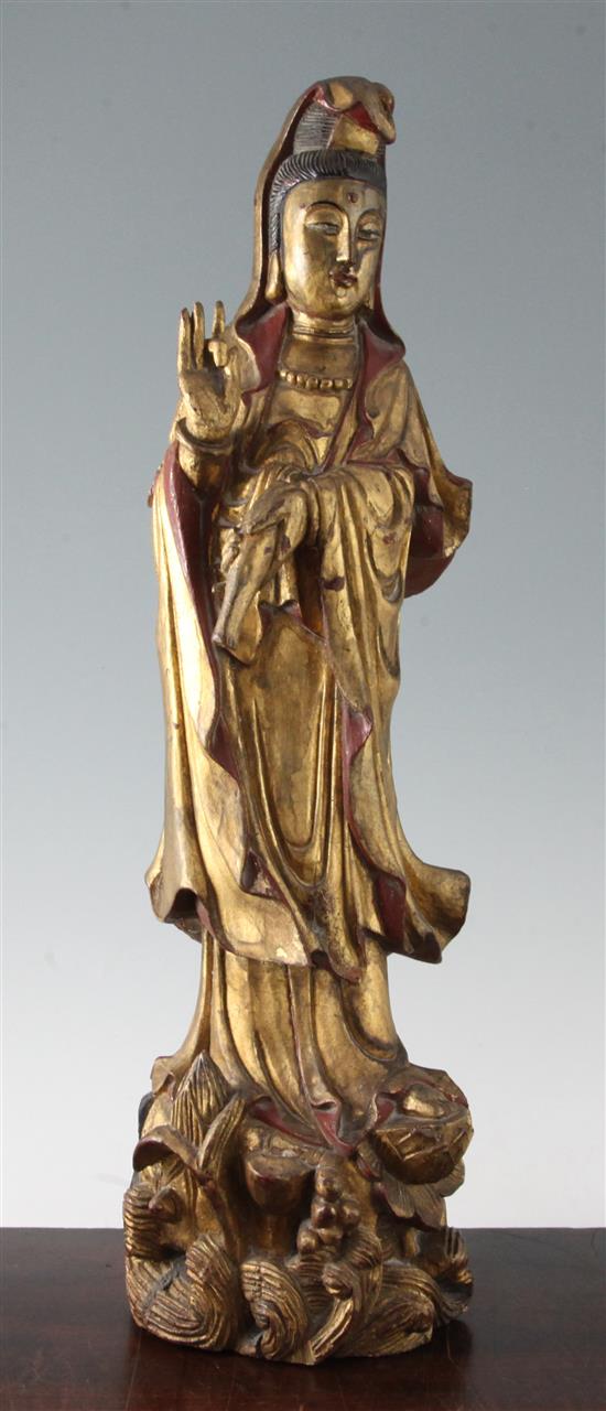 A late 19th century Chinese carved and giltwood figure of Guanyin, 20in.